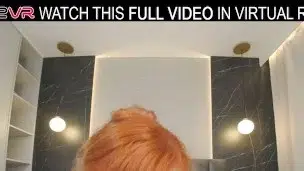 Hot redhead Lola Red plays with a huge dildo on the bed in VR.